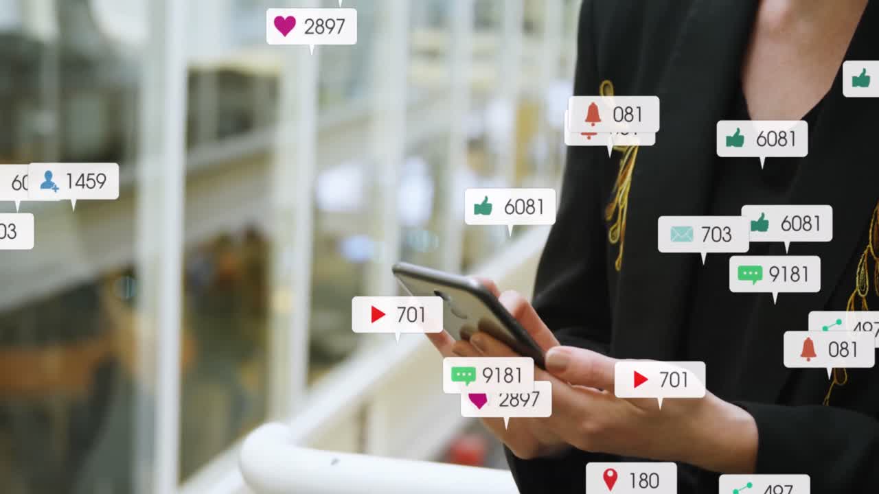 Animation of message icons with changing numbers over midsection of caucasian woman using cellphone