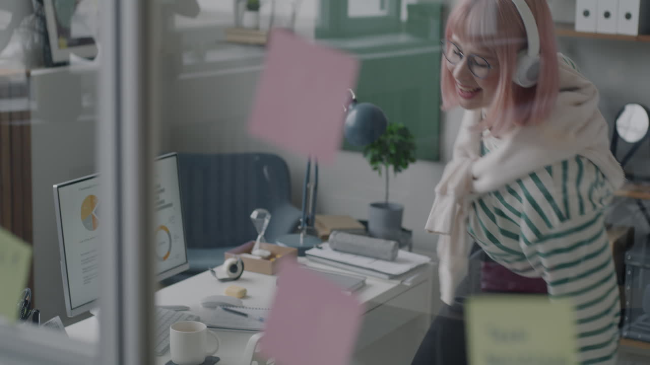 Happy Woman Celebrating Success in a Modern Office