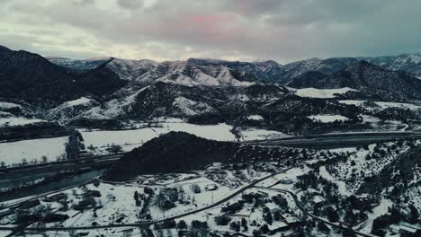 sunset - almost night aerial of dramatic aerial of mountains in colorado