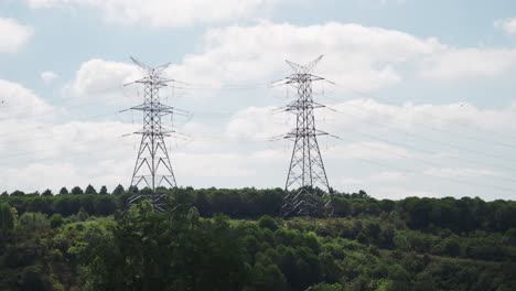 two power transmission towers in a rural landscape