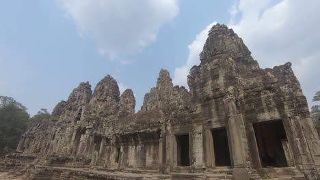 carved stone temple, angkor wat , against blue sky