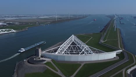 Aerial-flight-to-one-of-the-arms-of-the-Maeslantkering-storm-surge-barrier,-part-of-the-Delta-Works-and-one-of-the-largest-moving-structures-on-earth