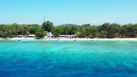 Peaceful-holiday-destination-tropical-island-with-tranquil-exotic-beach-washed-by-crystal-water-of-blue-turquoise-lagoon,-Bali