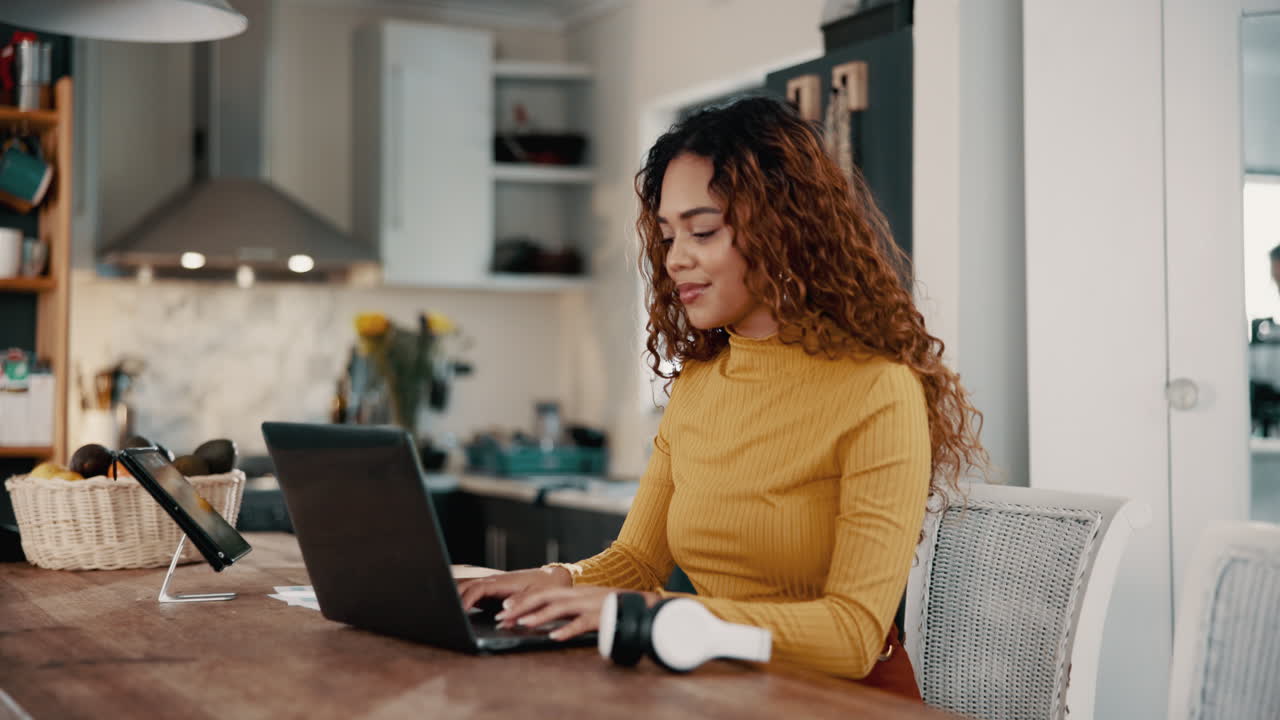 Smiling young woman with curly hair looking down