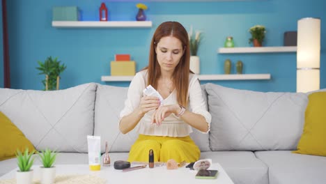 Young-woman-applying-cream-to-hand.-Skin-beauty.