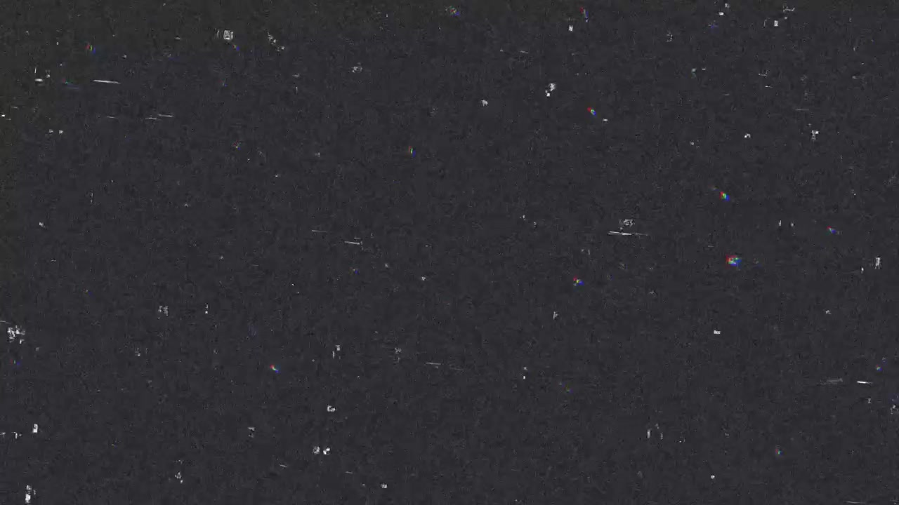 Partículas de Polvo Blancas Parpadeantes sobre Fondo Oscuro