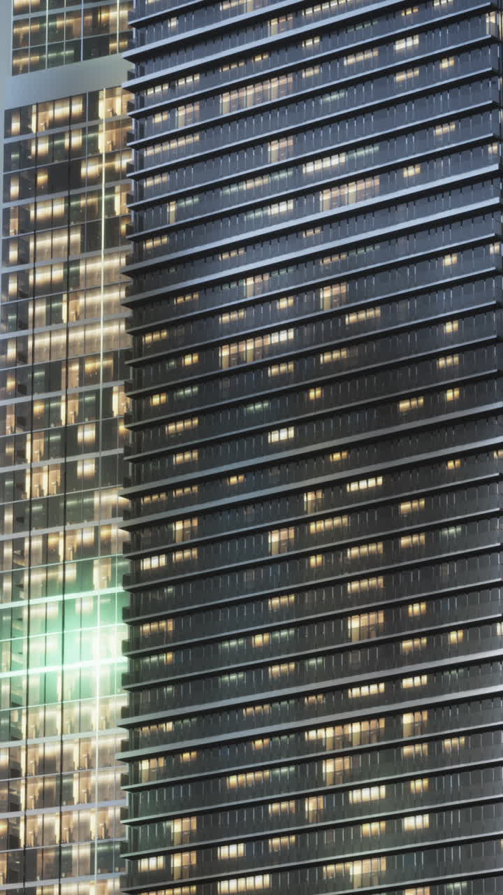 un rascacielos moderno con ventanas iluminadas por la noche