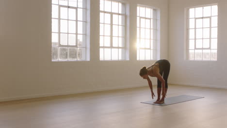 beautiful yoga woman practicing cobra pose enjoying fitness lifestyle exercising in studio stretching flexible body training early morning meditation on exercise mat