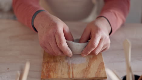 Pottery,-clay-bowl-and-craftsman-hands-in-artist