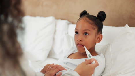 sick child, bed and mother with a thermometer to