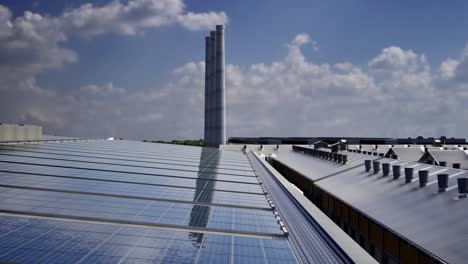 solar panels mounted on industrial building roof for producing clean ecological electricity. production of renewable energy concept