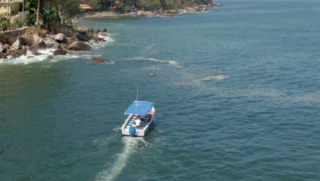 water taxi sailing in the pristine beach of yelapa, jalisco, mexico