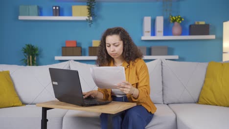 The-young-woman-examining-the-files-approves-the-files-with-her-head.