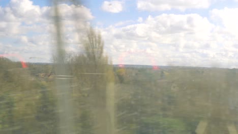 train window view, british countryside passing in a blur