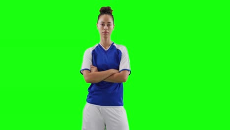 Video-of-portrait-of-caucasian-female-football-player-with-copy-space-on-green-screen