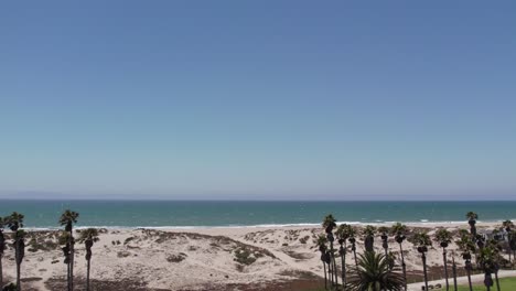 the beach and beachfront condos at oxnard shores in ventura, california - beautiful drone footage of a sunny day and pacific ocean