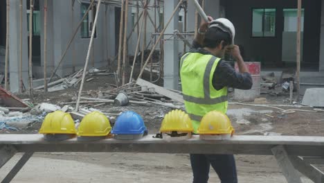 group team of young asian contractor and worker wearing hardhat walking to construction site with professional, architect and labor, builder and teamwork, engineer and colleague with friendship.