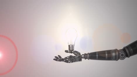 Animation-of-illuminated-light-bulb-over-hand-of-robot-arm,-with-pink-light-on-grey-background