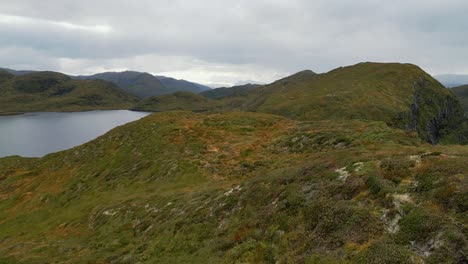 aerial over the rugged hills and lakes near vanylven municipality, norway