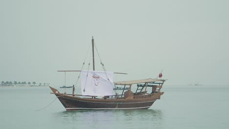 qatar national day one single boat floating