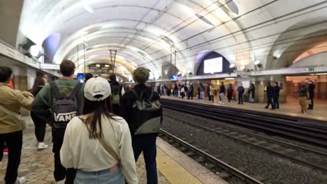 people waiting for a train in rome