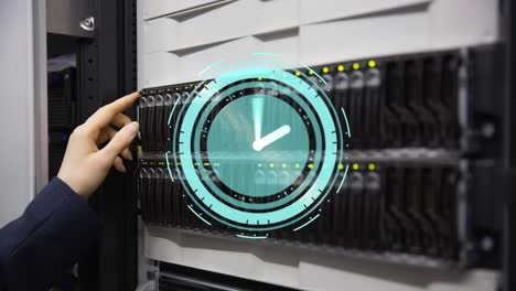 Animation-of-moving-clock-over-hands-of-caucasian-woman-in-server-room