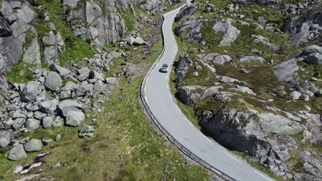 car driving over a beautiful pass road in the middle of norway-2