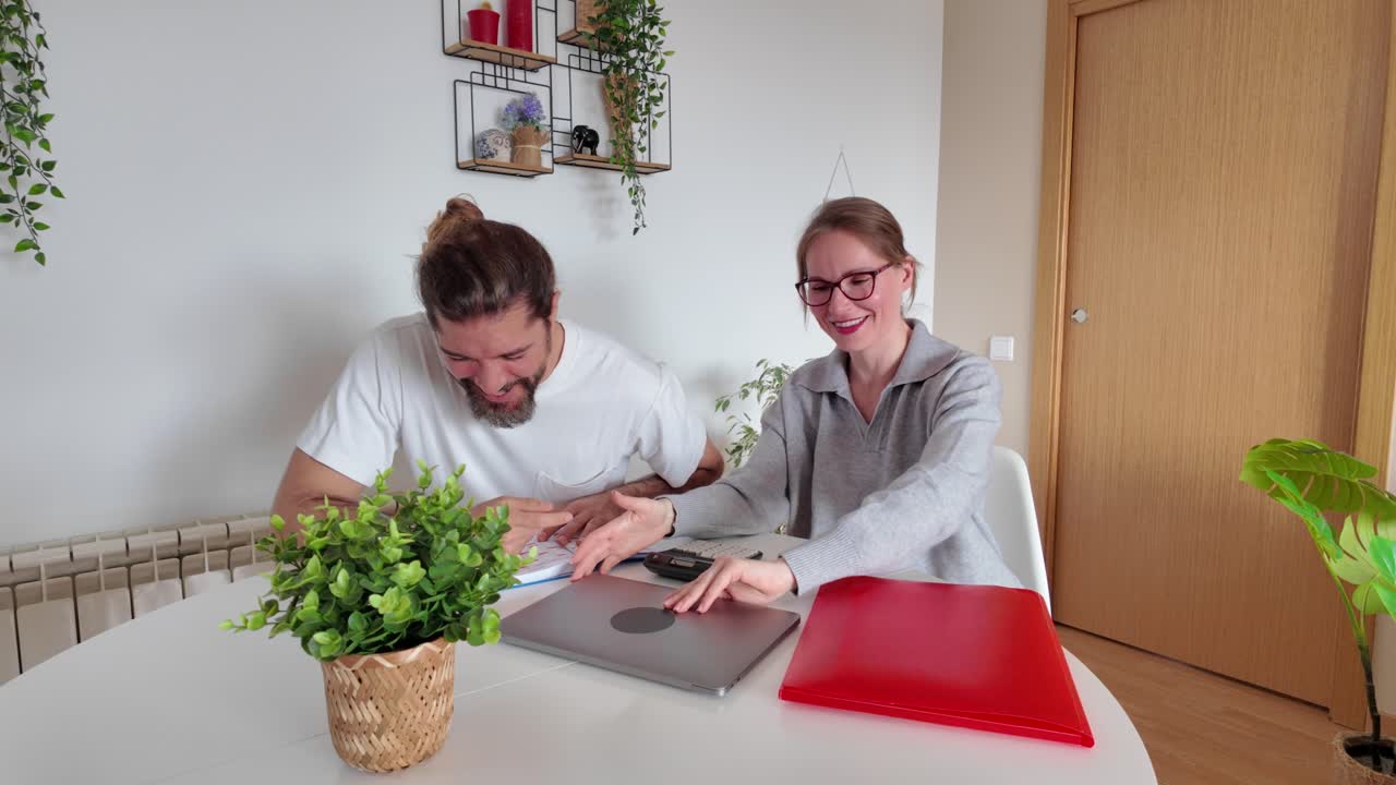 Couple working together at home office