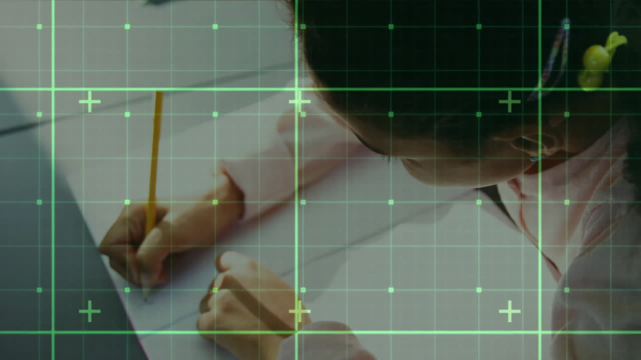 Girl writing on paper at desk, using education technology with augmented reality grid over laptop