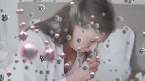 animation of virus cells over caucasian woman coughing
