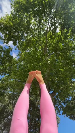 yoga pose under a tree