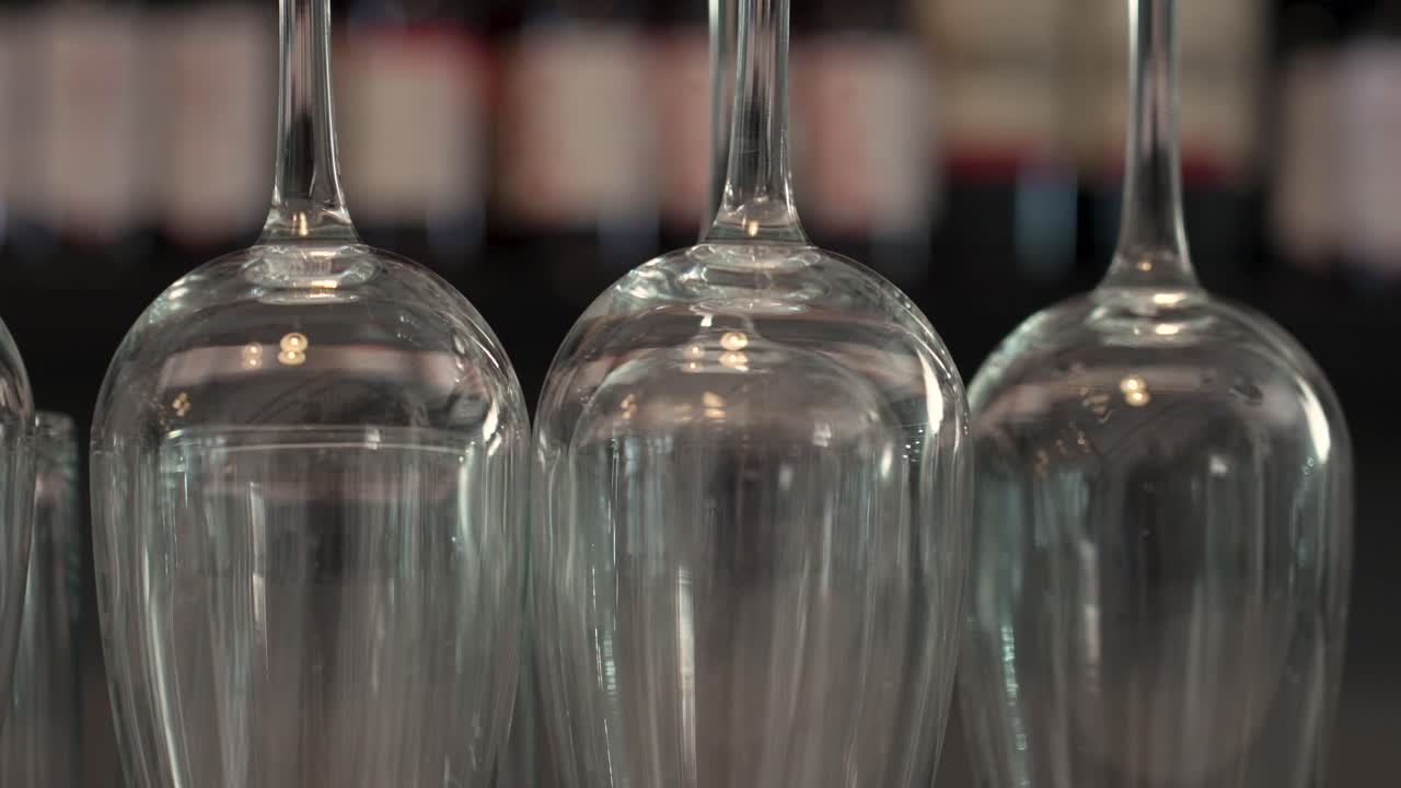 Elegant glassware shines brightly in an intimate setting at a cozy bistro on a warm evening - Close Up Shot
