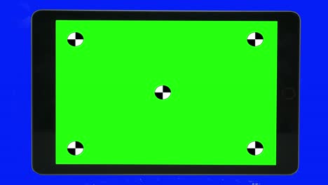 green screen technology concept. modern smart phone, tablet and computer mock up with green screen, alpha channel and tracking markers.