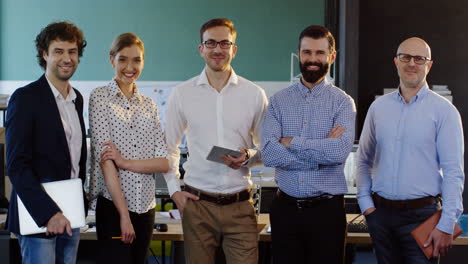 young multiethnic business team looking at camera in the office