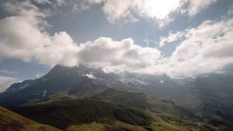 rotating timelapse of clouds forming between the mountains in a valley in switzerland 4k