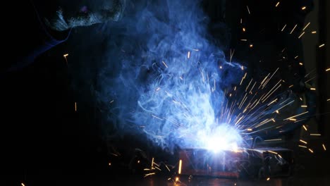 Welder-welding-a-metal