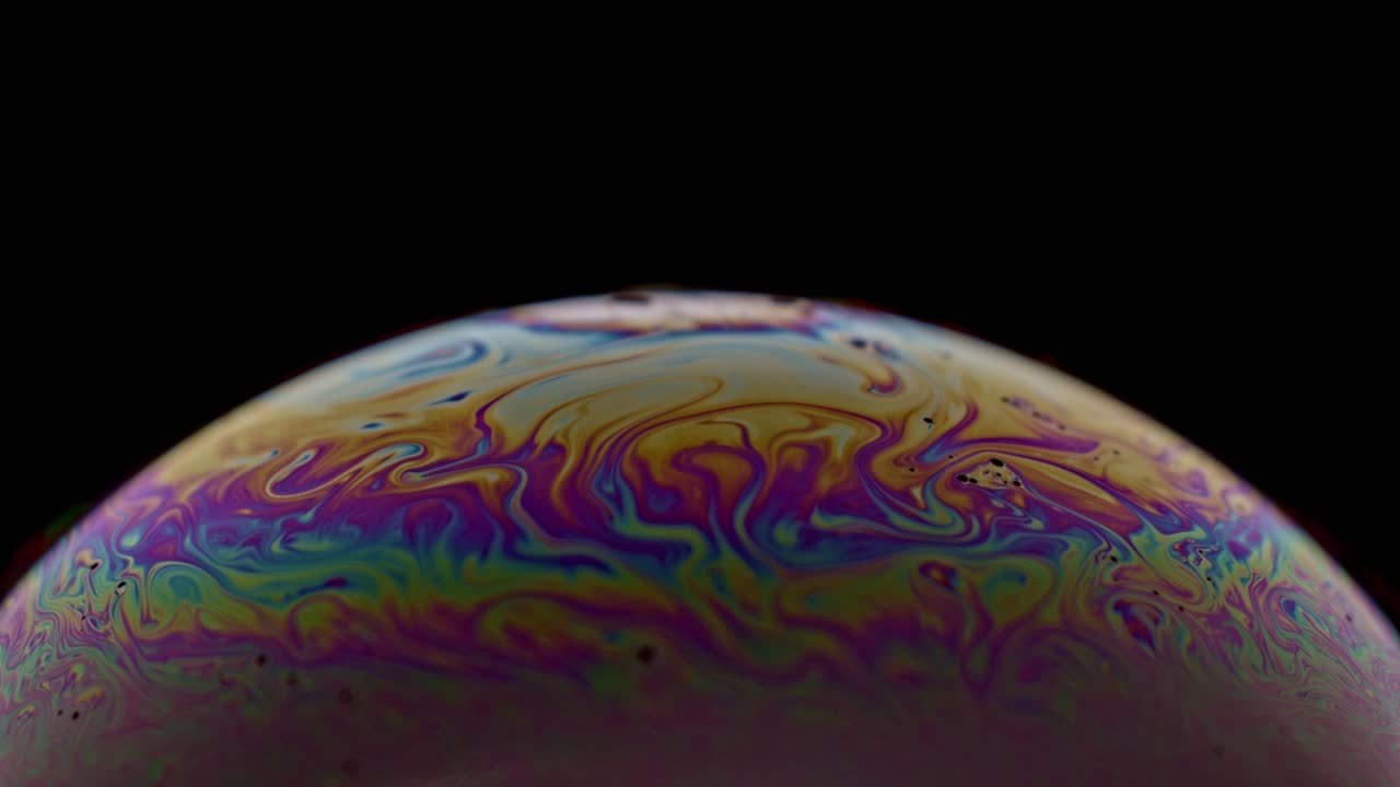 Closeup of a bubble with colors and animation for example for backgrounds