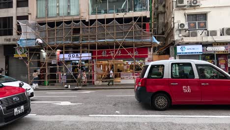 cars and taxis moving on a city street