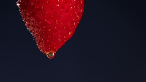 close-up of a wet strawberry with water droplet