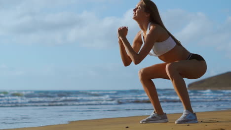 girl making workout leg at the beach. slow motion steadicam