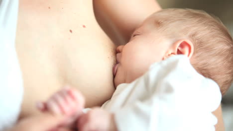 woman breastfeeding her baby