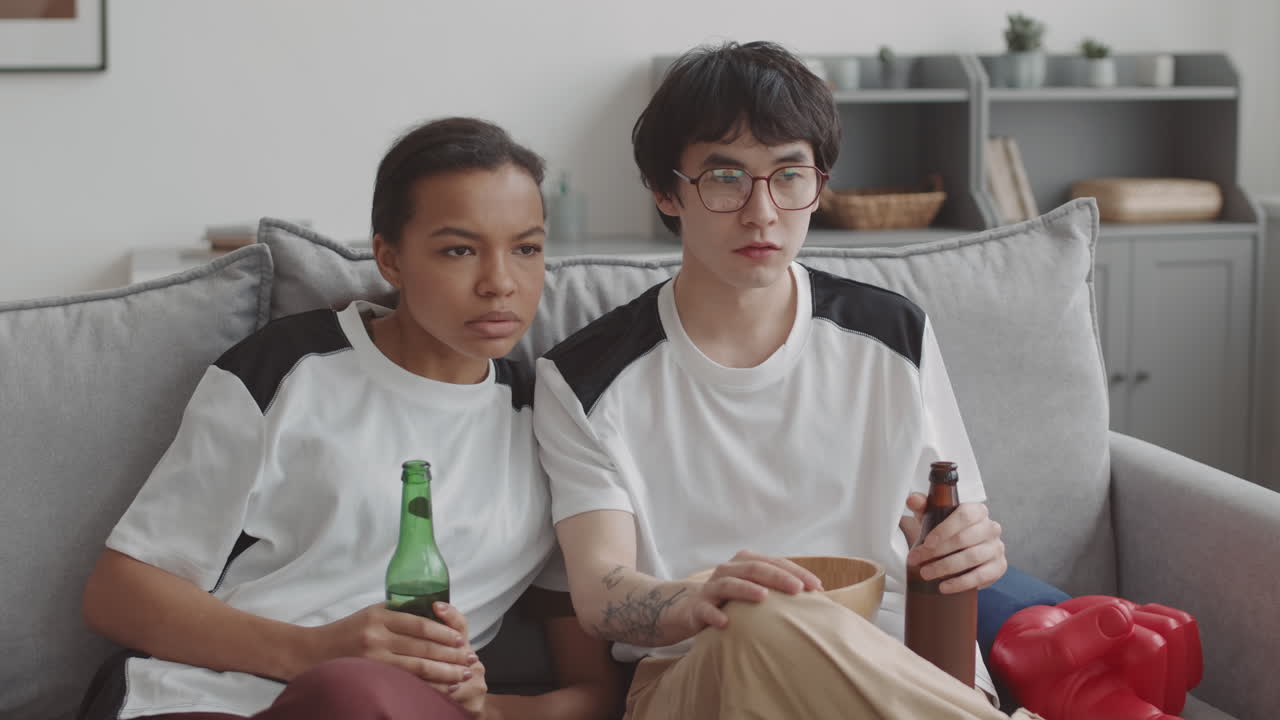 Multiethnic Couple Watching TV