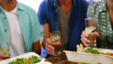 Business-executives-toasting-glasses-of-drink