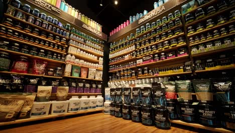 sport nutrition store interior with large choice of nutritional supplements.