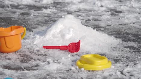 plastic toys in snow and ice