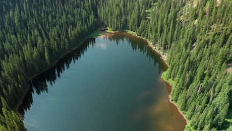 rotating aerial drone footage over beaver lake, in beaver creek, colorado