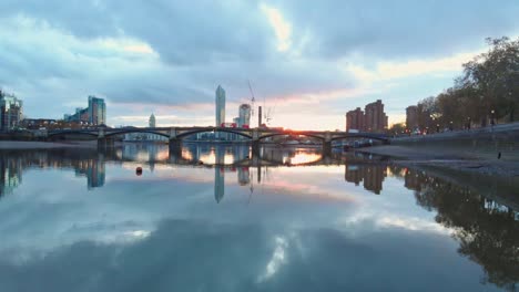 Low-slider-drone-shot-of-Battersea-bridge-London-at-sunset