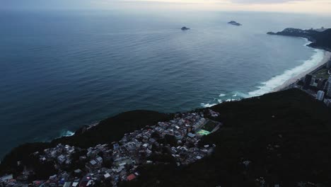 Aerial-view-over-the-Vidigal-district,-gloomy-evening-in-Rio-de-Janeiro,-Brazil