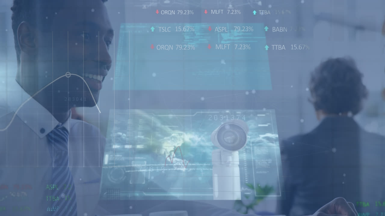 Animation of diverse data on screens over happy biracial businessman