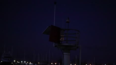 flashing navigation light at night in marina